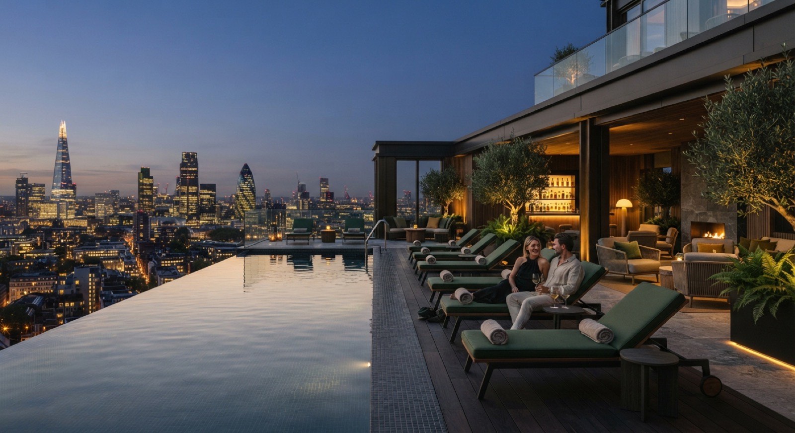 Serene rooftop infinity pool and sky lounge of a luxury condominium at dusk